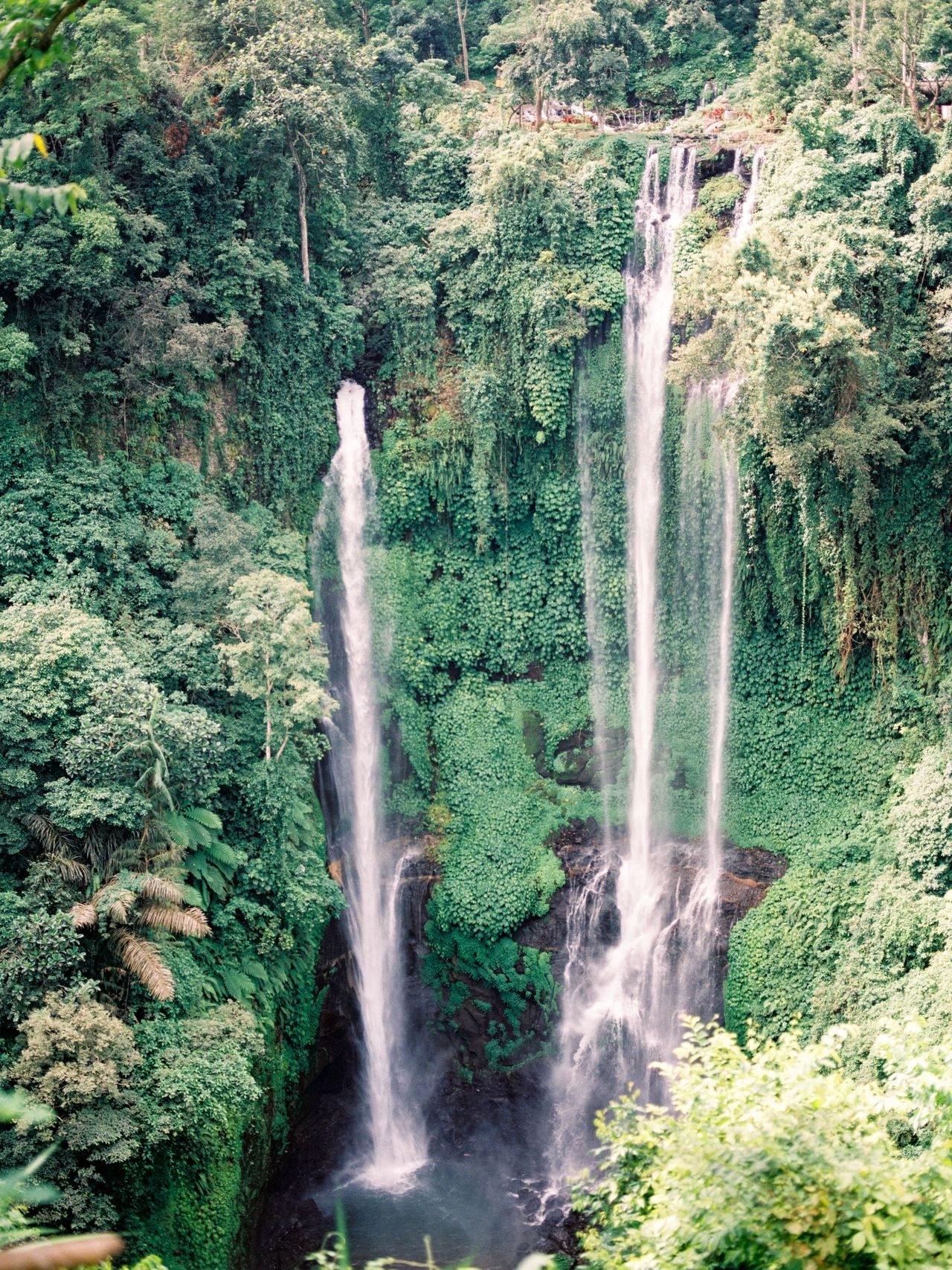 Waterfall cascading through Bali jungle