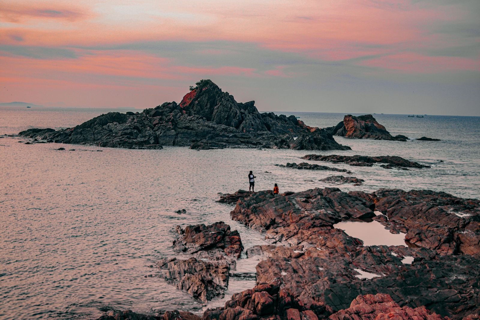 Rocky cliffs and sea at sunset, Gokarna