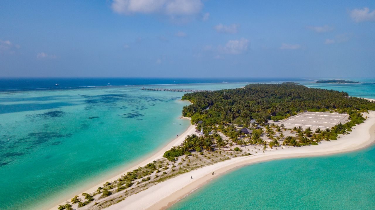 A tropical Maldives island in a turquoise sea