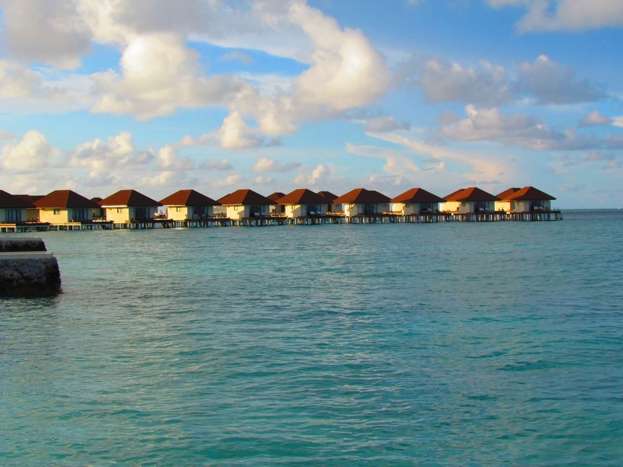 Maldives overwater bungalows at sunset