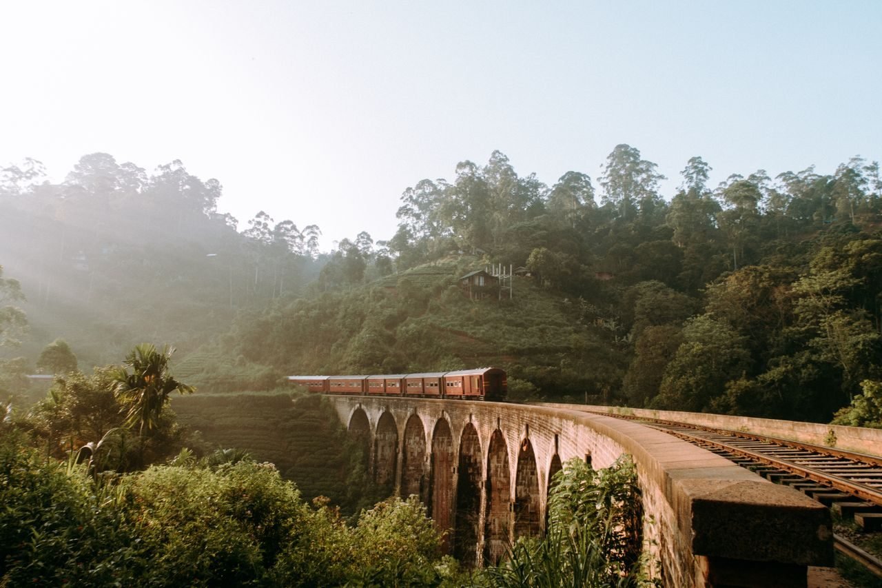 A train crossing a bridge in the Sri Lankan hills