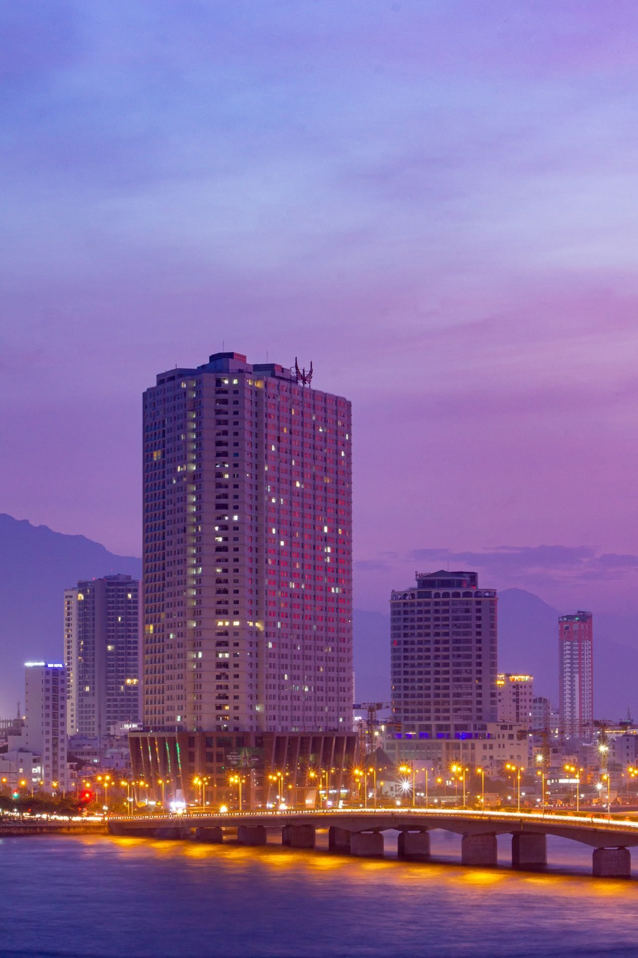 Da Nang skyline and bridge at dusk, Vietnam